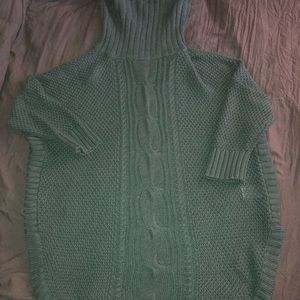 Quarter length sweater, turtle neck.